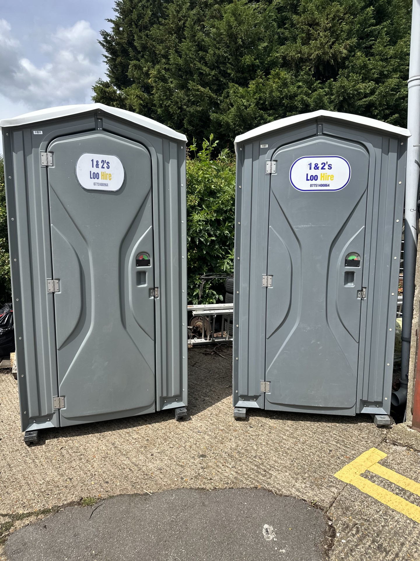 Clean grey portable toilet units from 1 & 2's Loo Hire, ready for delivery across Berkshire